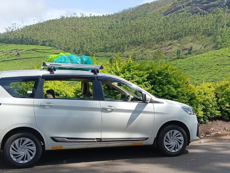 Car with Munnar hill Background View