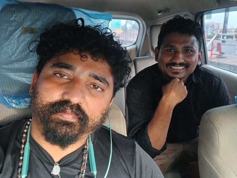 Driver Antony posing with a traveler