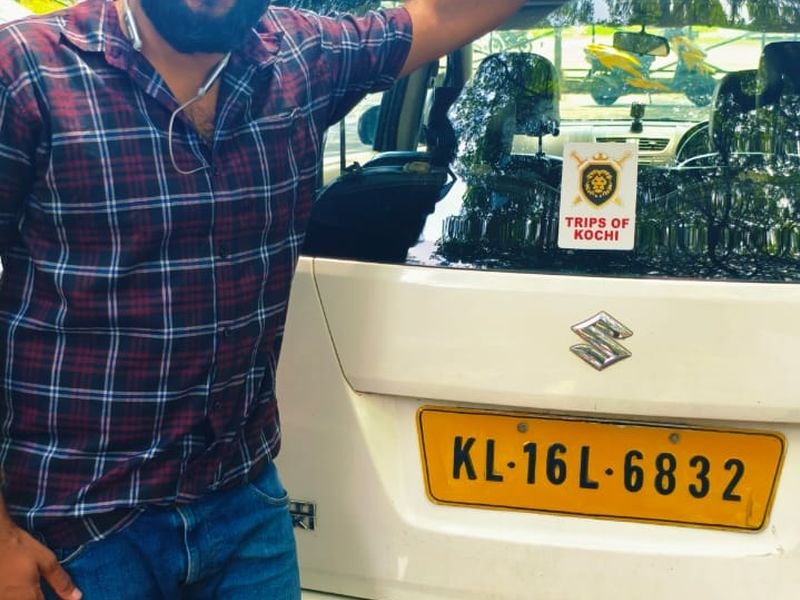 Posing with trips of Kochi Logo taxi 1