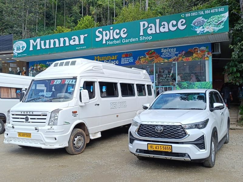 Tempo Traveller and Cabs parked at Munnar near Spice Palace